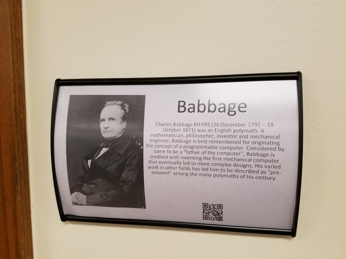 Nameplate with Babbage bio and photo and a QR code