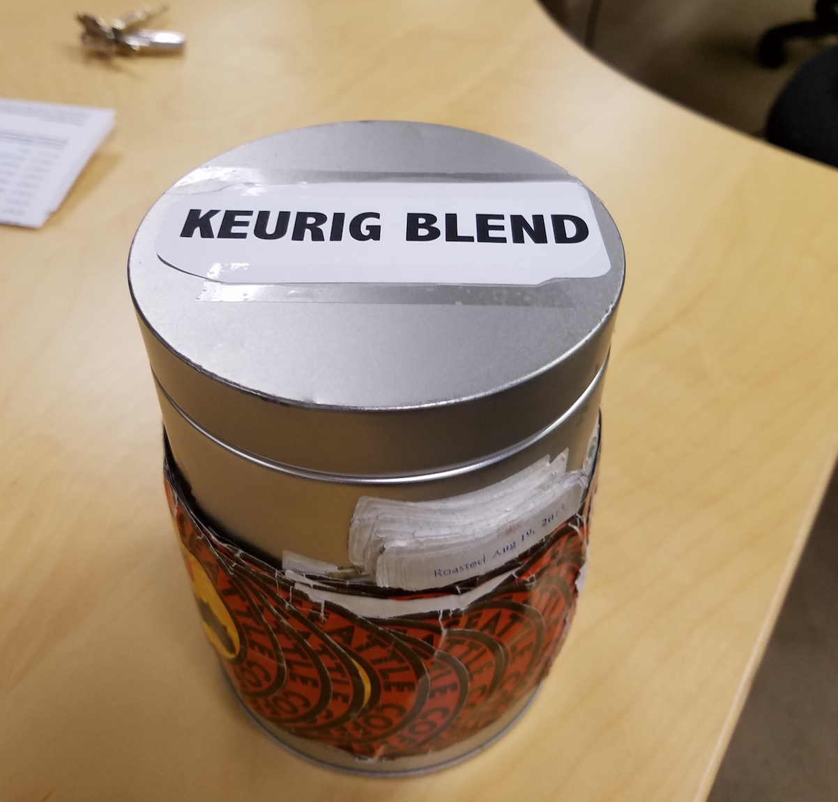 Closed coffee can with printed 'Keurig Blend' label on top