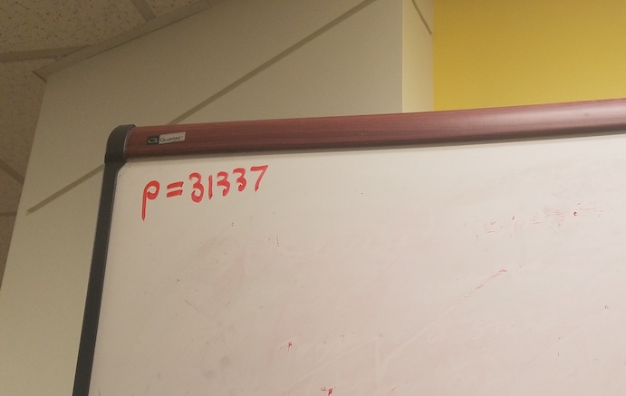 'p=31337' written on the top corner of a whiteboard
