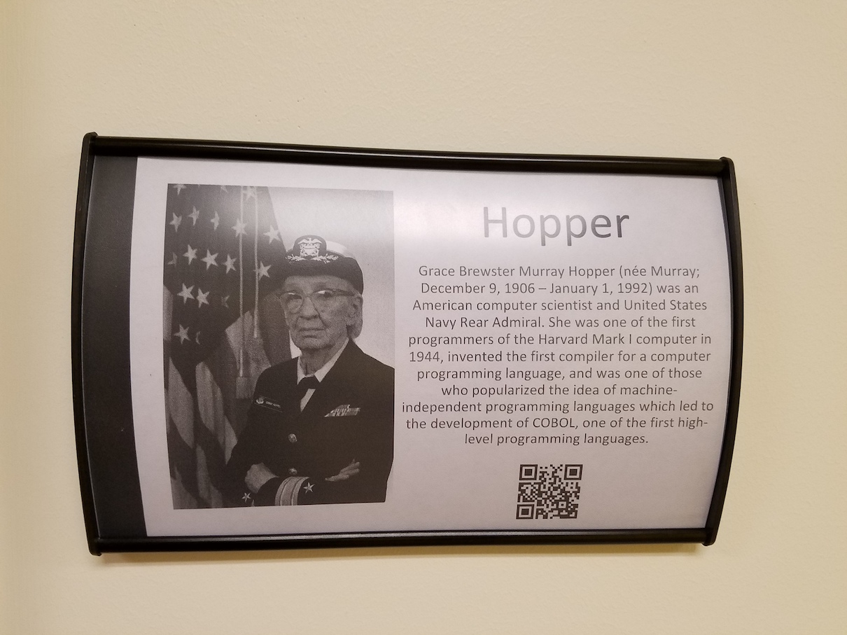 Nameplate with Hopper bio and photo and a QR code